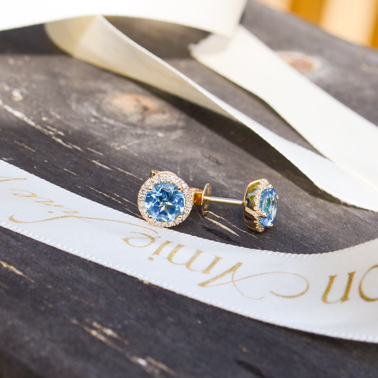 14kY 2.06cttw Blue Topaz .14cttw Diamond Stud SC55006938