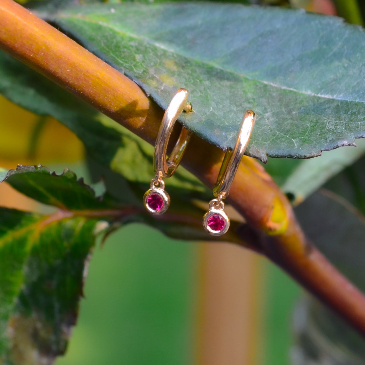 14kY .08cttw Ruby Bezel Drop Hoop SC55026150