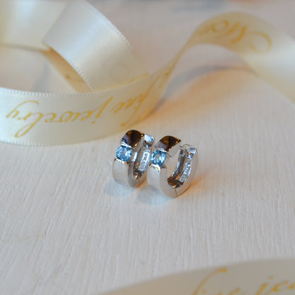 SS .65cttw Blue Topaz Huggie Hoop SEM85TLBT