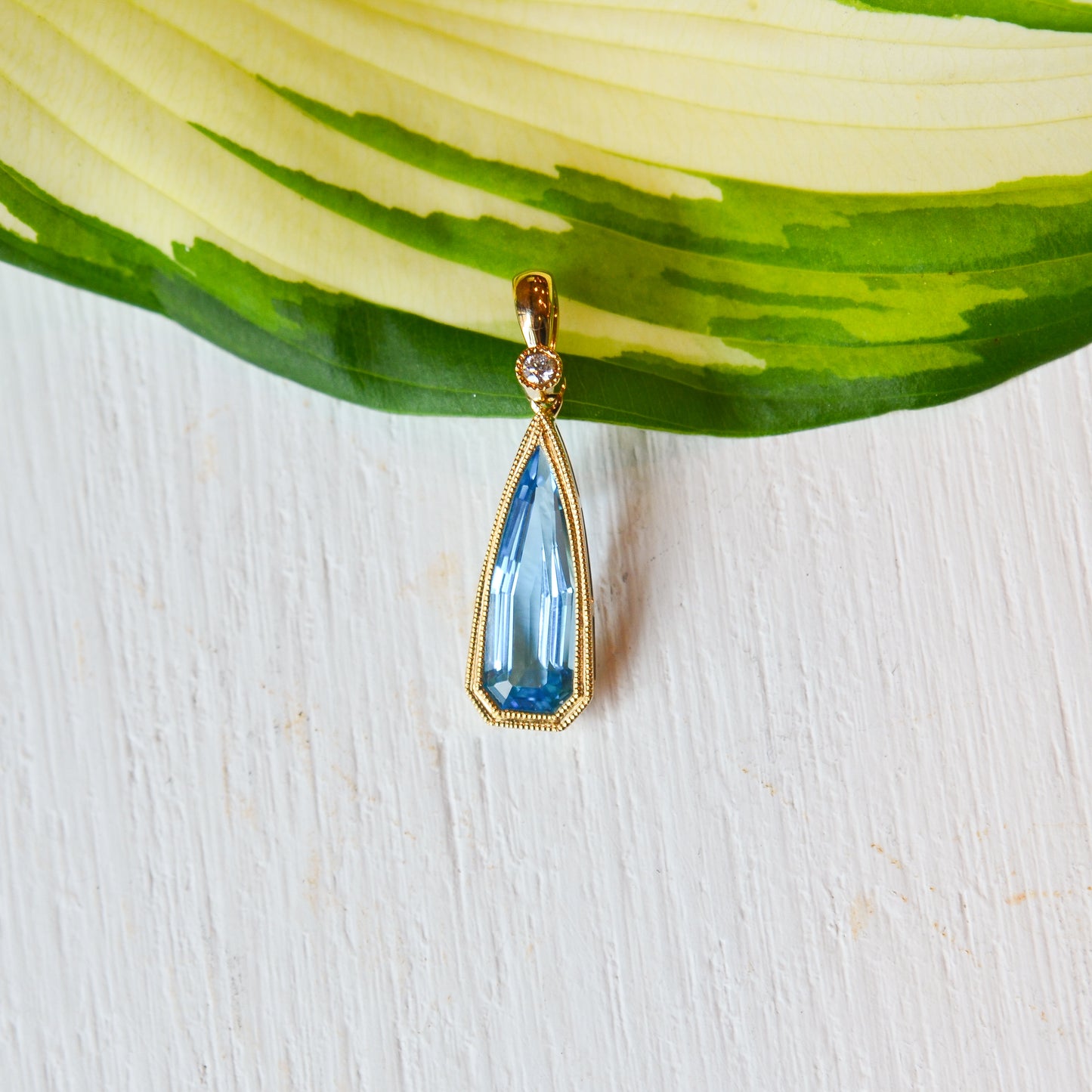 14kY 2.50ct Blue Topaz .03ct Diamond Pendant TPA4689NBT