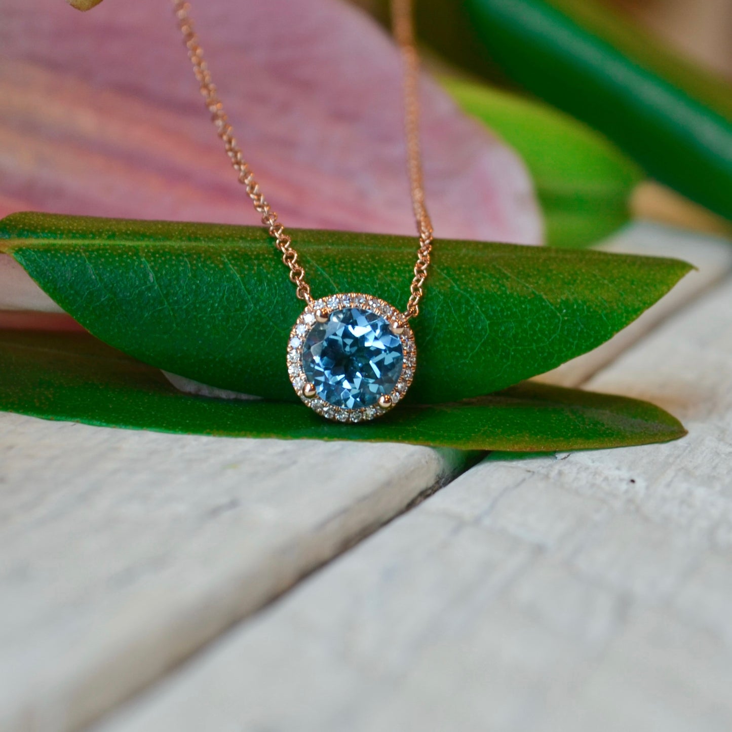 14kR 1.80ct Blue Topaz .08cttw Dia Necklace SC55007031